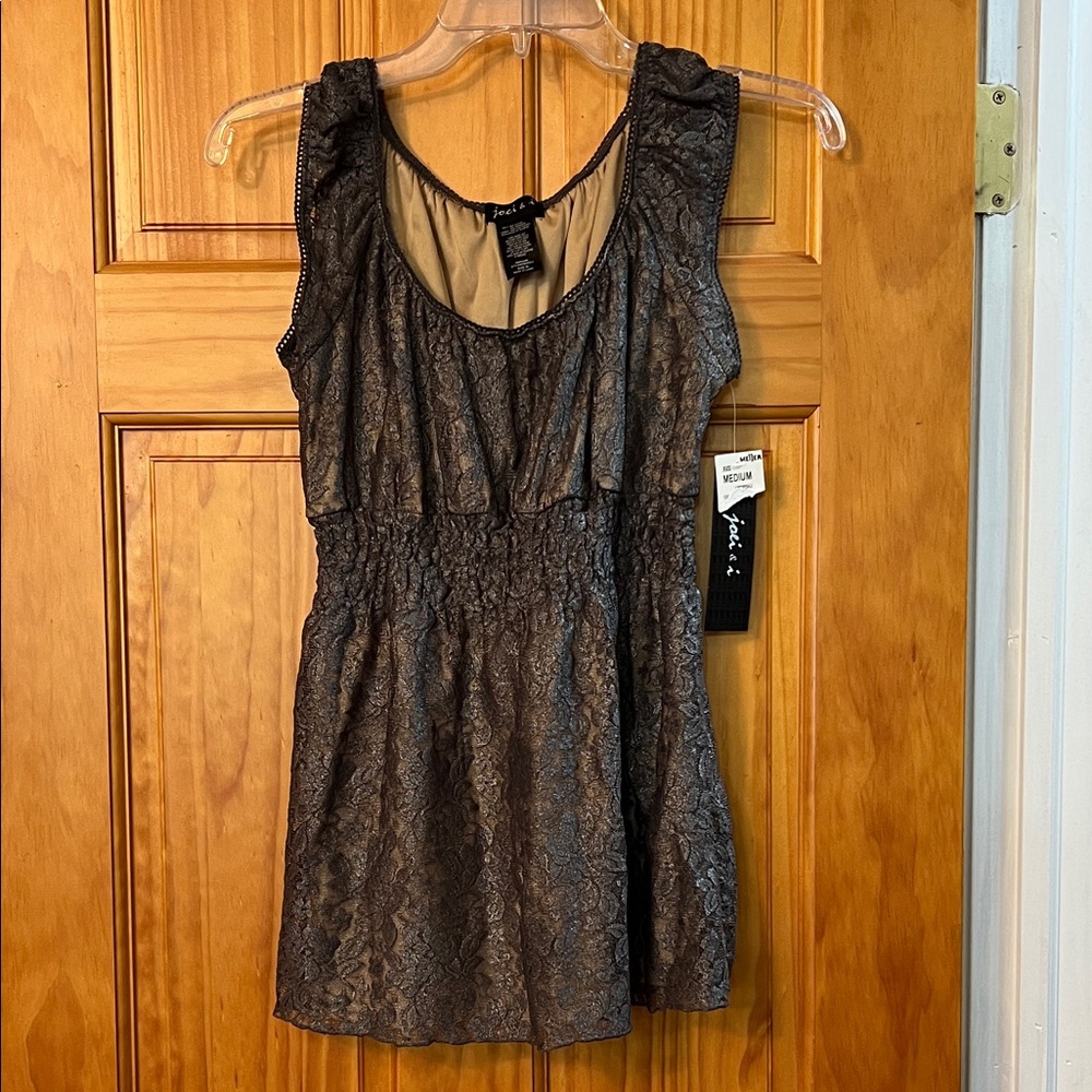Lace, lined, sleeveless, cute edge around straps and neckline
